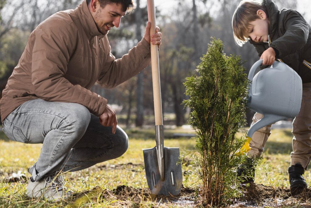 Father and son planting trees